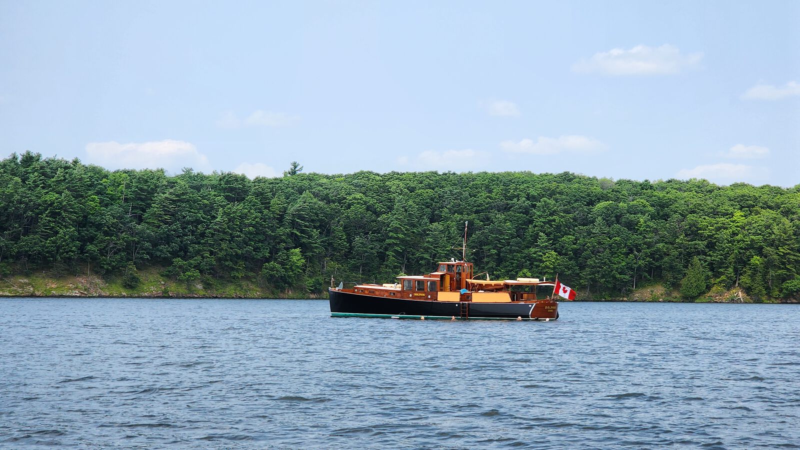 A wooden heritage boat on the Rideau Canal